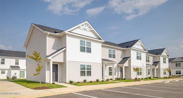 4119 Laurel Ridge Dr Unit F, Greenville, NC 27834 - multi unit property featuring uncovered parking, board and batten siding, and a residential view