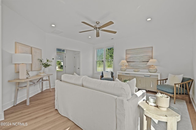 living room with baseboards, ceiling fan, light wood-type flooring, and recessed lighting