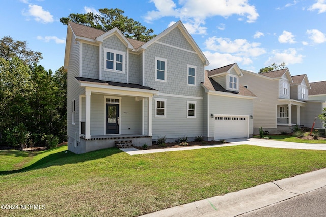 view of front of property with covered porch, driveway, and a front yard