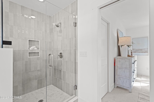 bathroom with a shower stall