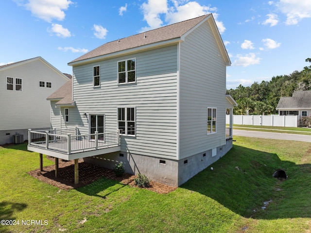 back of house with crawl space, a yard, fence, a wooden deck, and central air condition unit