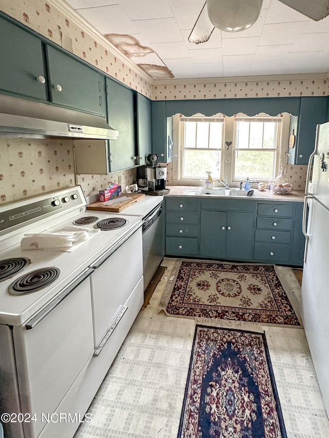 kitchen featuring white appliances, sink, and light tile floors