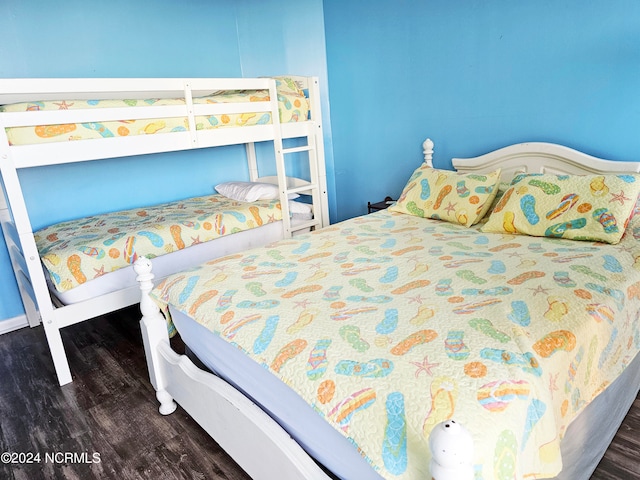 bedroom featuring dark wood-type flooring