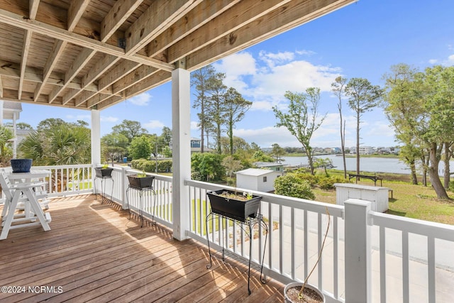 wooden deck featuring a water view