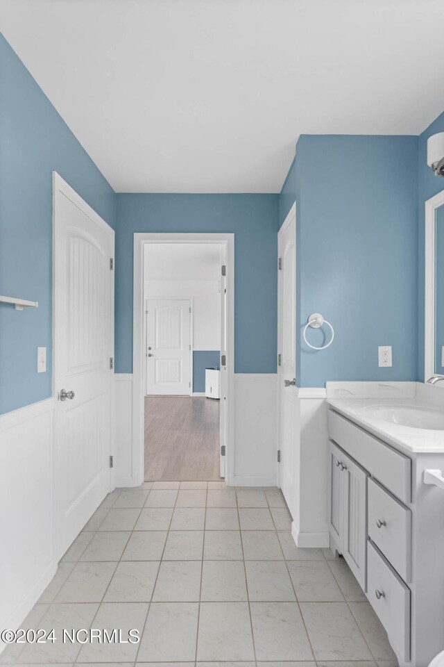 bathroom featuring tile patterned flooring and vanity