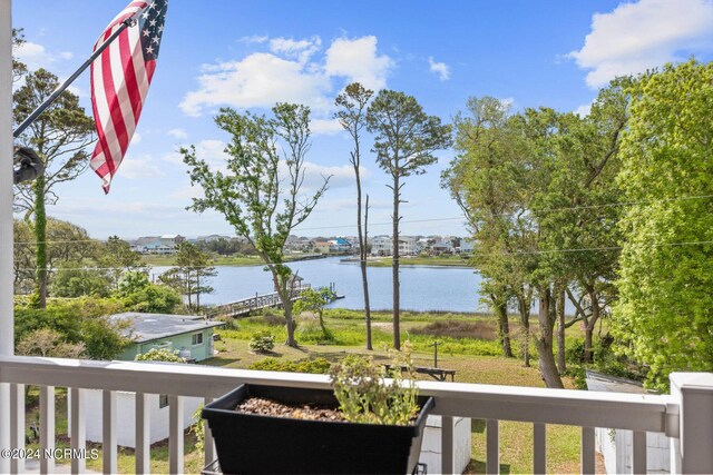 drone / aerial view featuring a water view and a residential view