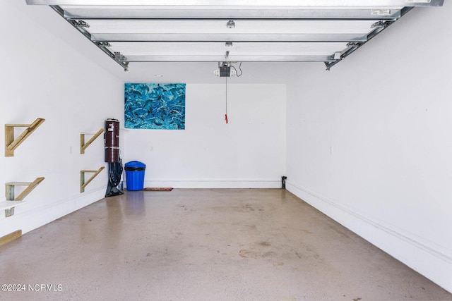 garage featuring baseboards and a garage door opener