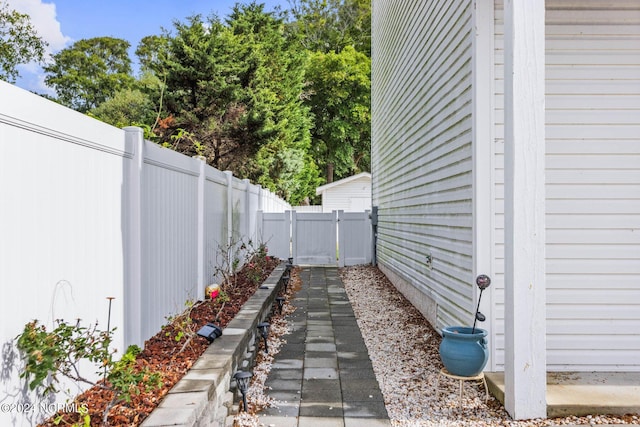 view of yard with fence and a gate