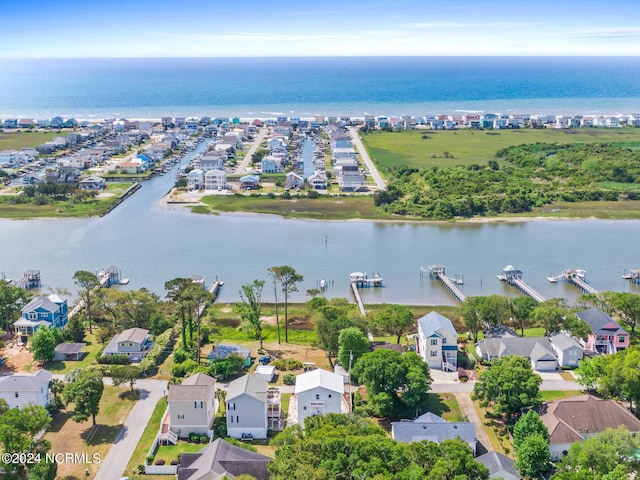 birds eye view of property featuring a water view and a residential view