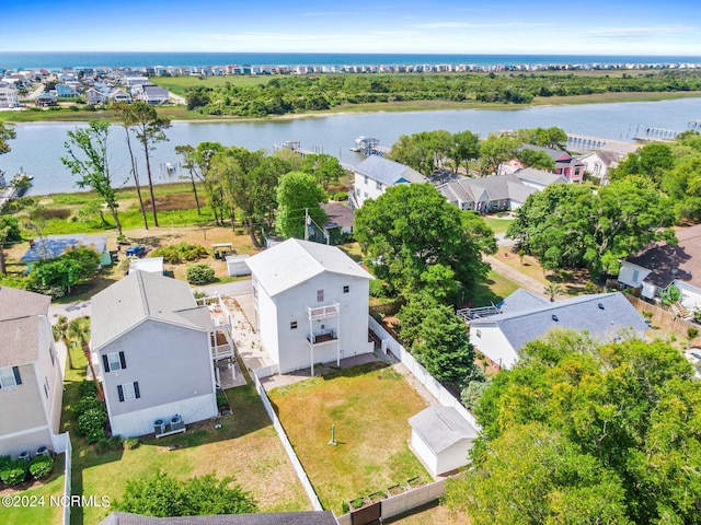 drone / aerial view featuring a residential view and a water view