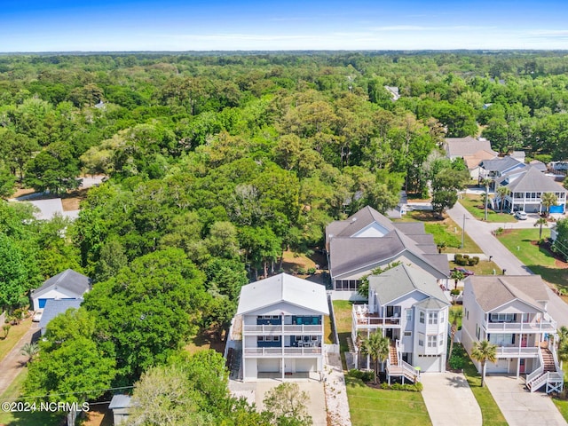 aerial view with a wooded view and a residential view