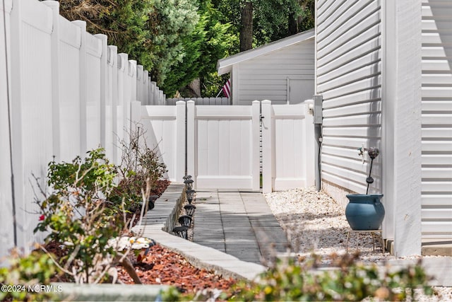 exterior space featuring fence and a gate