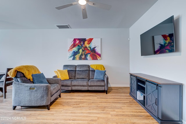 living room with ceiling fan and light wood-type flooring