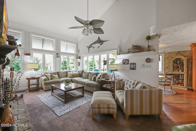 living room featuring hardwood / wood-style flooring, ceiling fan, ornamental molding, high vaulted ceiling, and french doors