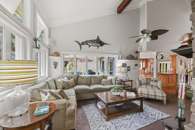 living room with beamed ceiling, high vaulted ceiling, plenty of natural light, and ceiling fan