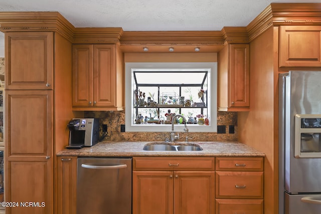 kitchen featuring sink, backsplash, and stainless steel appliances