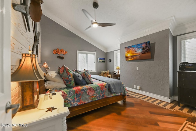 bedroom with ceiling fan, hardwood / wood-style floors, ornamental molding, a textured ceiling, and lofted ceiling