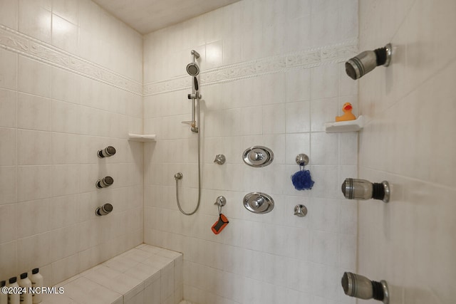 bathroom with tiled shower