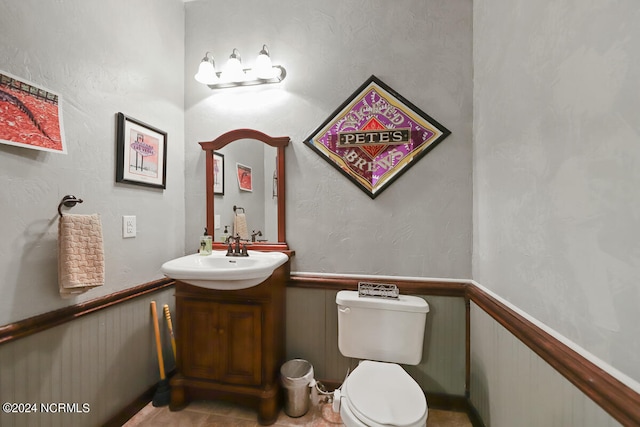 bathroom featuring oversized vanity and toilet