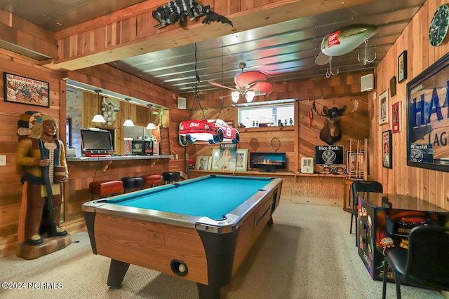 game room featuring light carpet, wood walls, and pool table