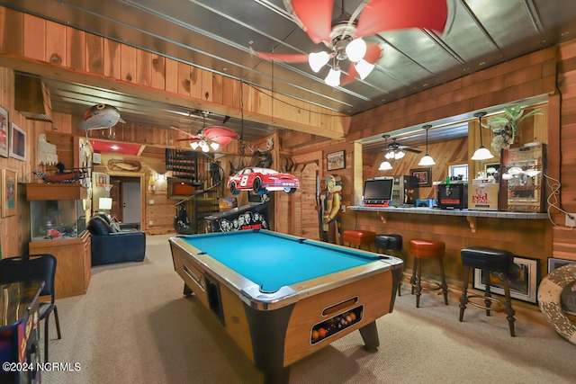 rec room featuring wooden walls, ceiling fan, light colored carpet, and pool table