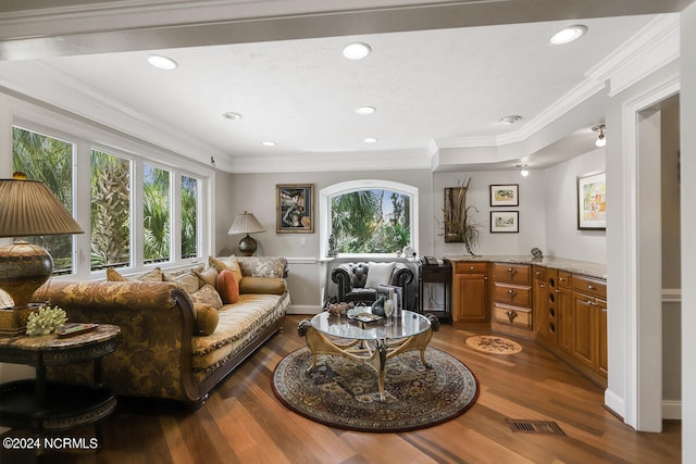 living room featuring dark hardwood / wood-style floors and crown molding