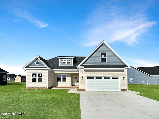 craftsman-style home with a front yard and a garage