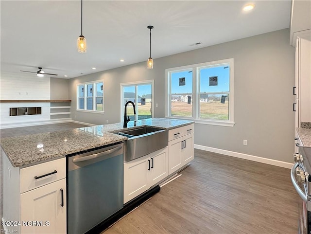 kitchen with dark hardwood / wood-style flooring, white cabinetry, stainless steel dishwasher, ceiling fan, and sink