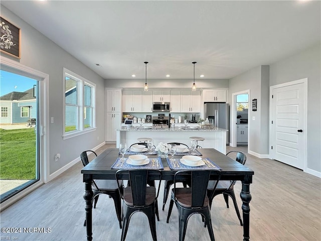 dining room featuring light hardwood / wood-style flooring