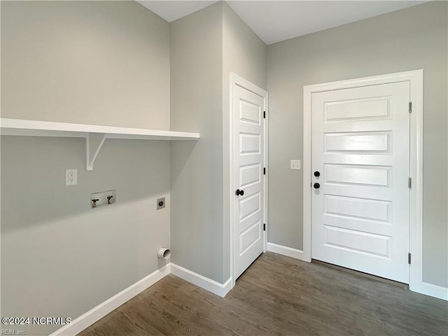 clothes washing area featuring electric dryer hookup and dark hardwood / wood-style floors