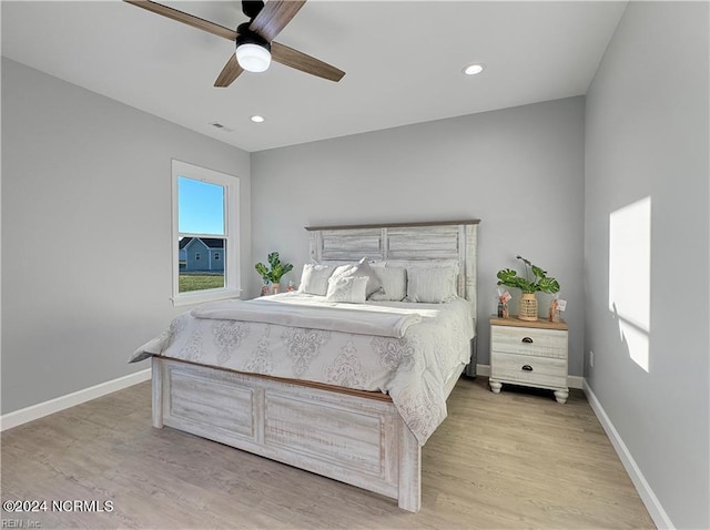 bedroom featuring light hardwood / wood-style floors and ceiling fan