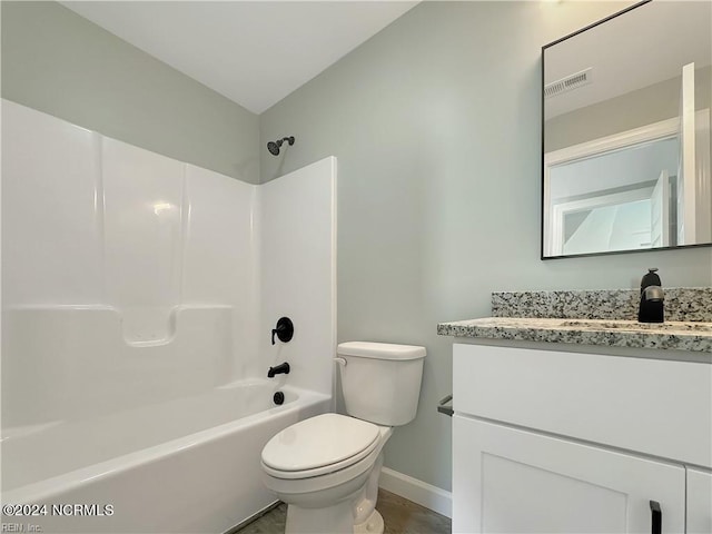 full bathroom featuring toilet, tile floors, washtub / shower combination, and large vanity