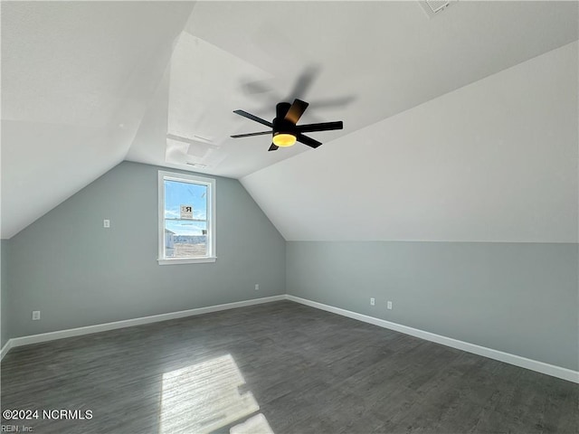 additional living space with vaulted ceiling, ceiling fan, and dark hardwood / wood-style flooring