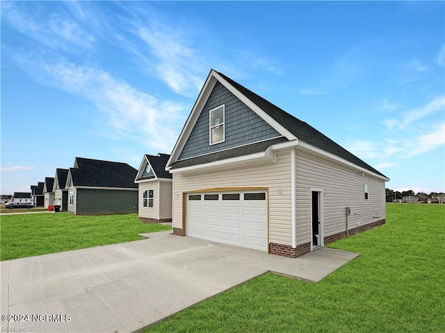 view of front facade with a front yard and a garage