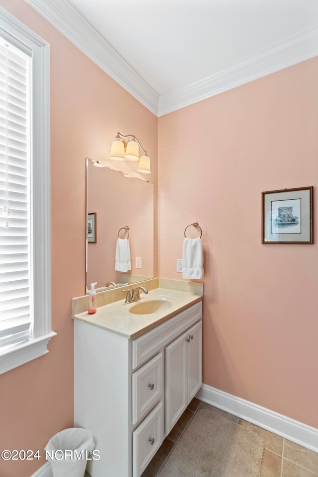 bathroom with crown molding, vanity, and tile flooring