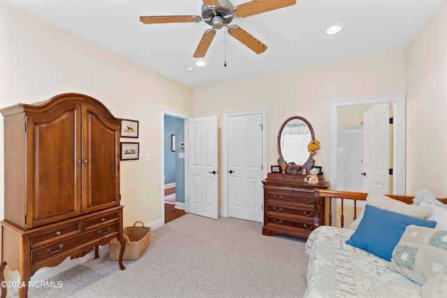 interior space with light carpet and ceiling fan