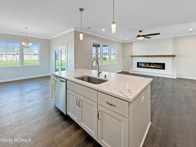 kitchen with stainless steel dishwasher, a center island with sink, dark wood-type flooring, and sink