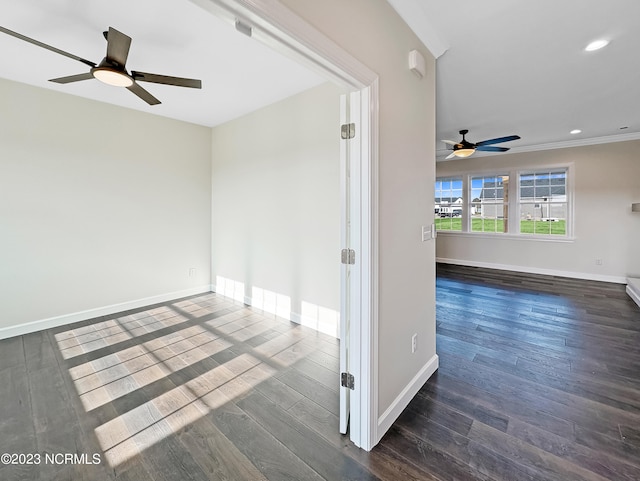 spare room featuring ceiling fan and dark hardwood / wood-style floors