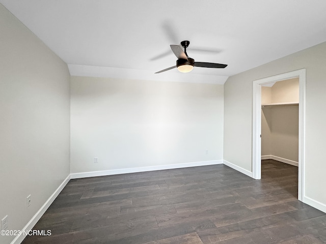 unfurnished room featuring dark hardwood / wood-style floors and ceiling fan