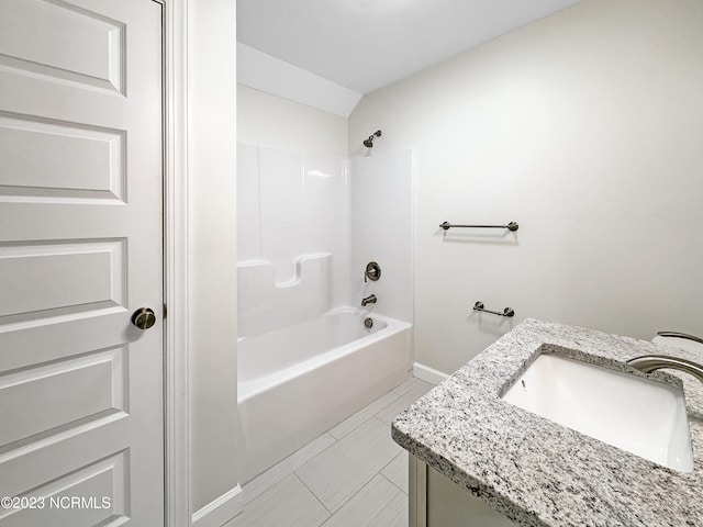 bathroom with shower / bathing tub combination, tile flooring, and vanity