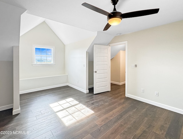 bonus room with dark hardwood / wood-style flooring, ceiling fan, and vaulted ceiling