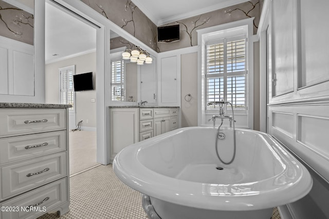 bathroom with ornamental molding, vanity, tile flooring, and a washtub