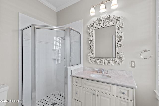 bathroom featuring toilet, an enclosed shower, vanity, and crown molding