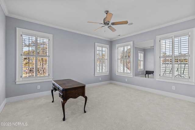 interior space with ceiling fan, crown molding, light carpet, and a healthy amount of sunlight