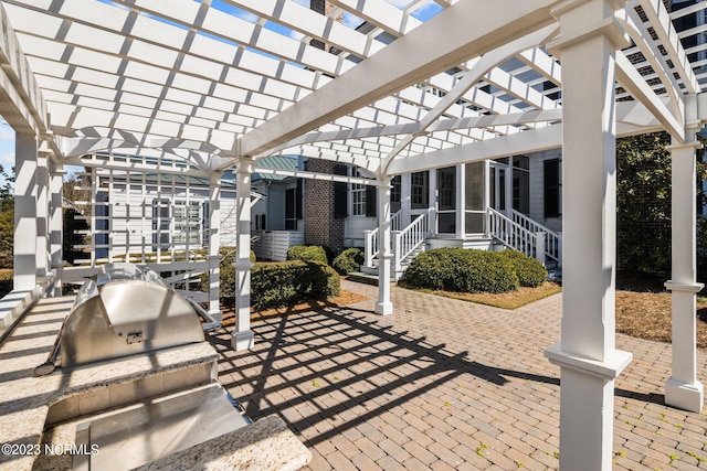 view of patio featuring a pergola and area for grilling