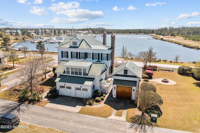 birds eye view of property with a water view