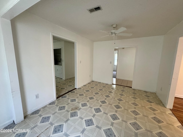 empty room featuring ceiling fan and light tile floors