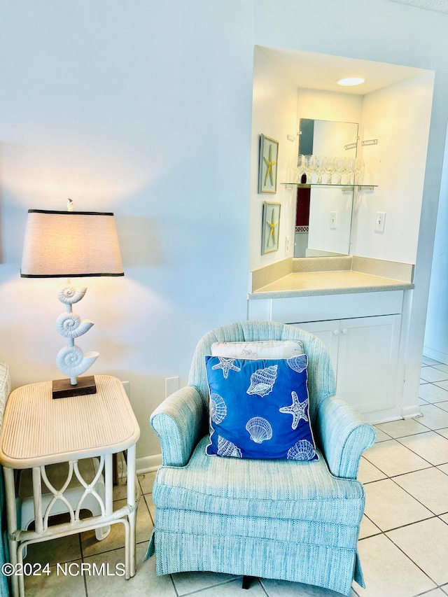 sitting room featuring light tile flooring