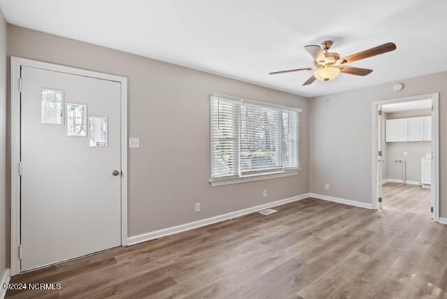 entrance foyer featuring ceiling fan and light hardwood / wood-style floors