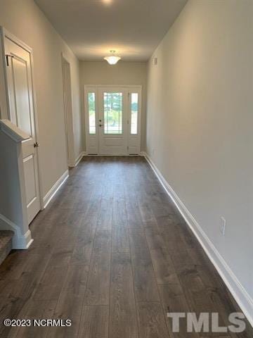 spare room featuring dark hardwood / wood-style floors